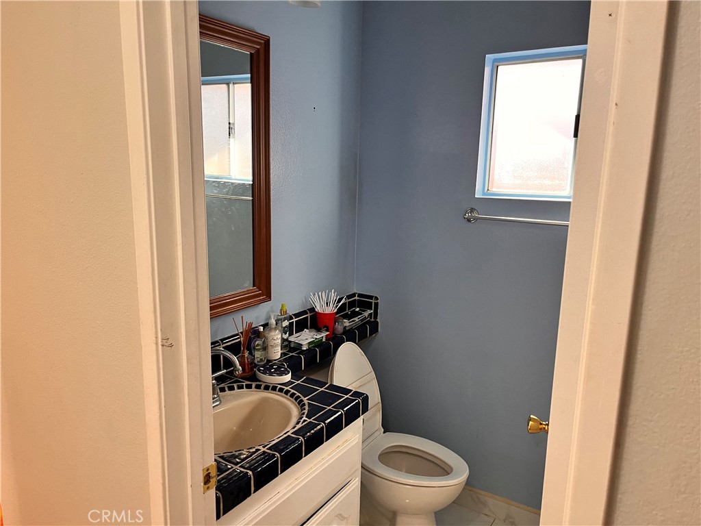 19849 Collins Road Canyon Country, CA 91351 - Photo 28 of 32 a bathroom with a sink and a toilet