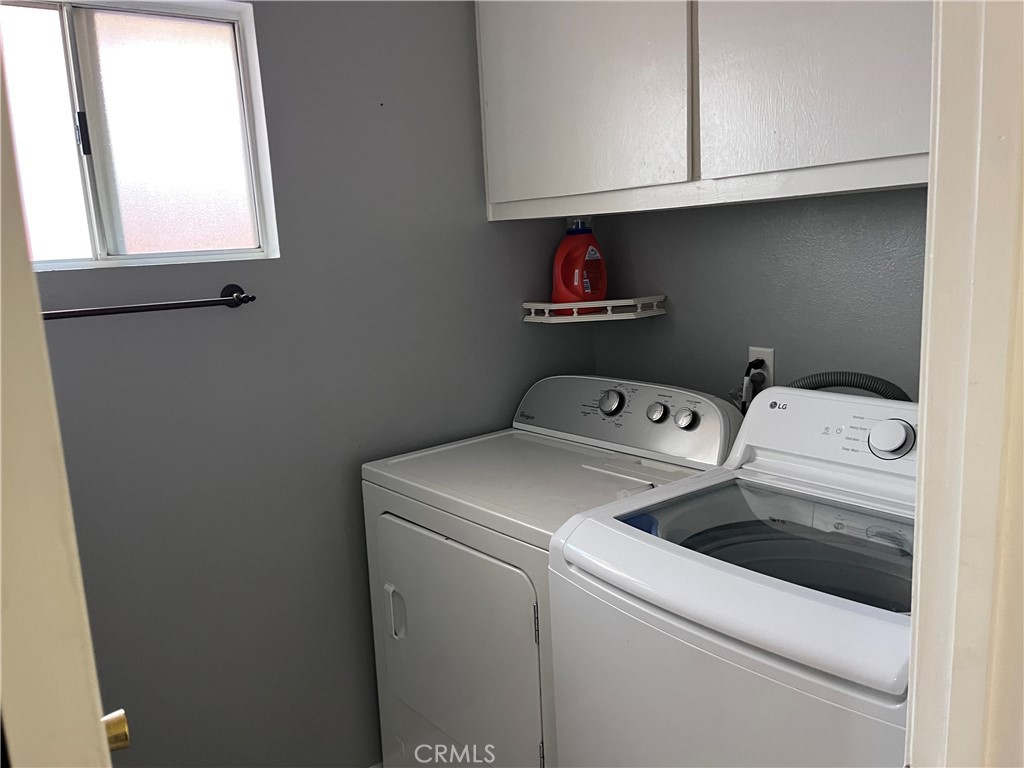 19849 Collins Road Canyon Country, CA 91351 - Photo 29 of 32 a utility room with dryer and washer