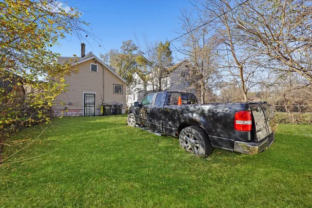 a view of a house with a back yard