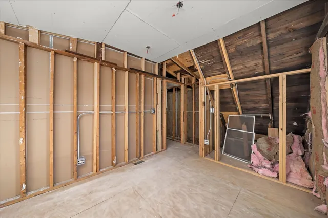 a view of entryway with wooden walls