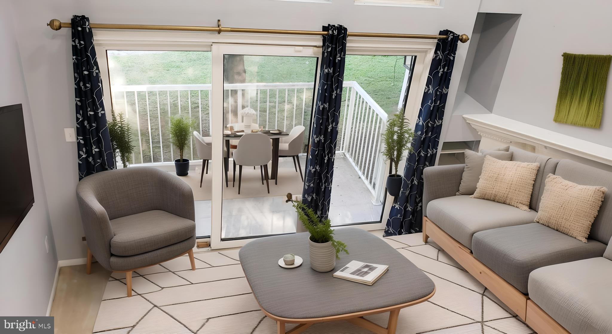 a living room with patio furniture