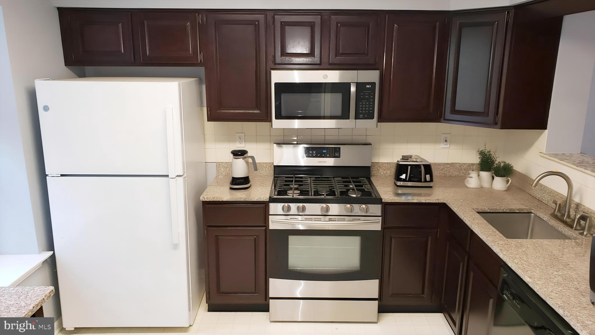 Halstead Place Princeton, NJ 08540 - Photo 2 of 18 a kitchen with stainless steel appliances granite countertop a refrigerator stove a sink dishwasher and microwave with cabinets