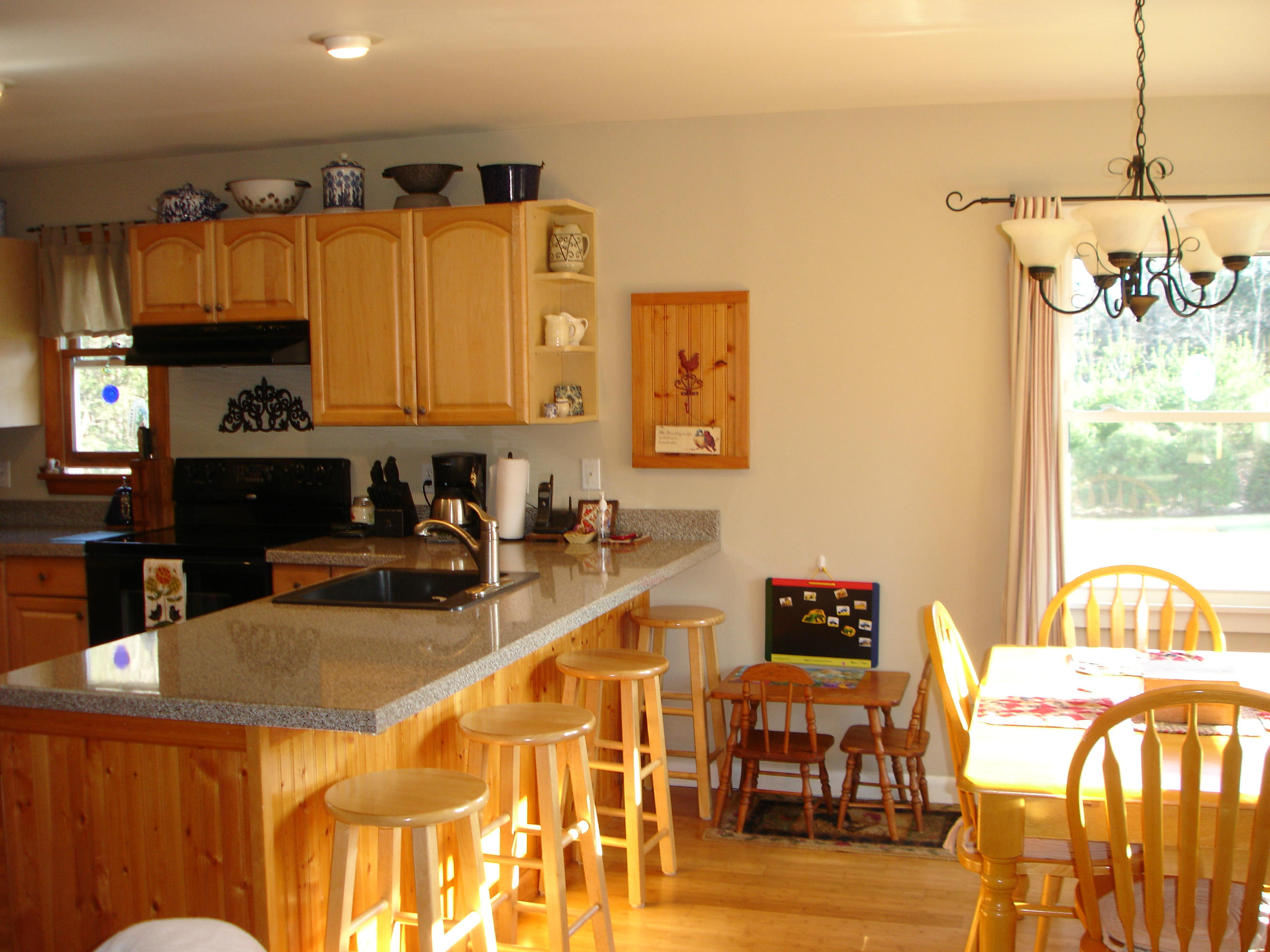 358 North Main Road Otis, MA 01253 - Photo 3 of 18 a kitchen with a sink and a refrigerator