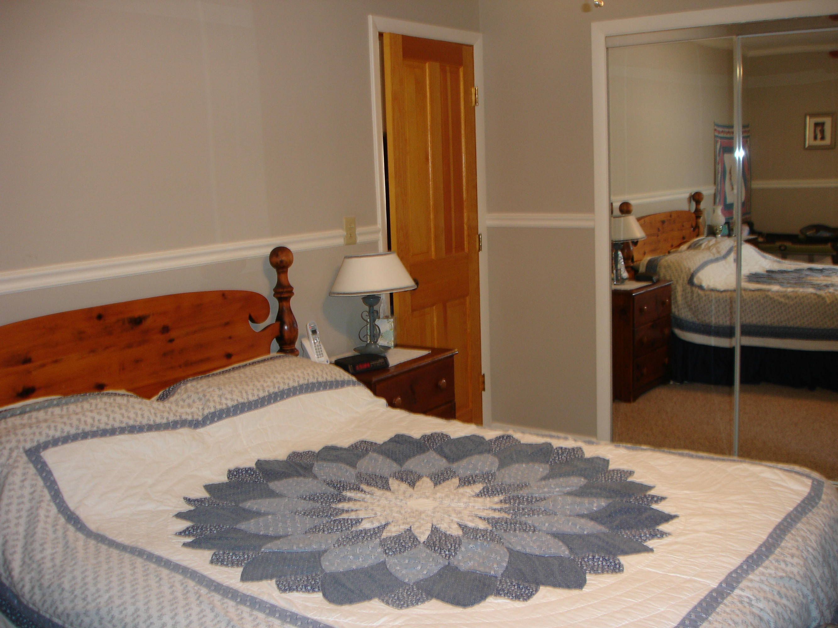 358 North Main Road Otis, MA 01253 - Photo 8 of 18 a bedroom with a bed and chair