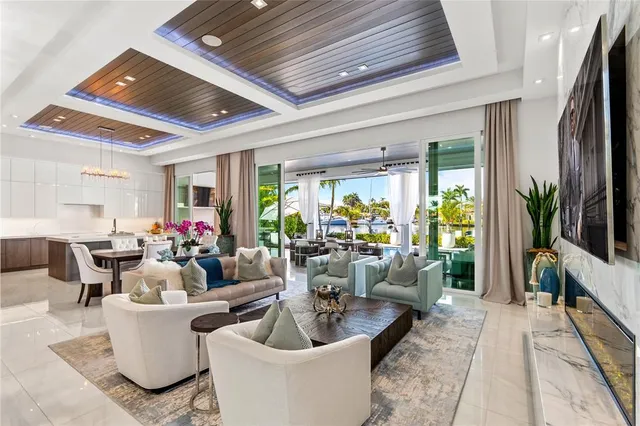 a bedroom with a large bed couch and a potted plant