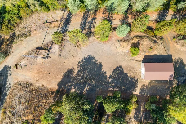 a aerial view of a house with a yard