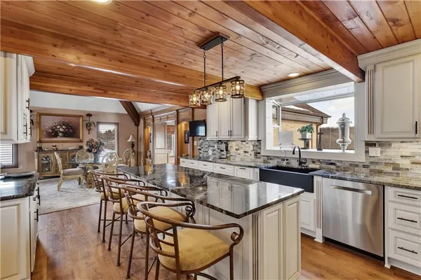 a kitchen with lots of counter top space and dining table