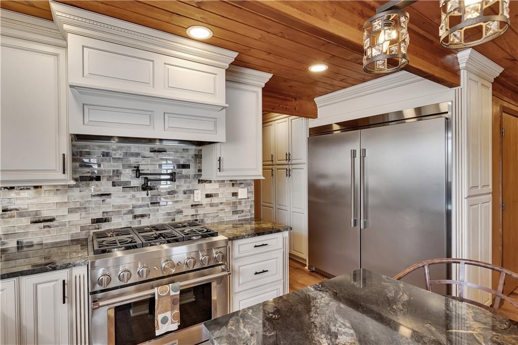 204 South Links Avenue Butler, PA 16001 - Photo 15 of 49 a kitchen with stainless steel appliances granite countertop a stove and a refrigerator