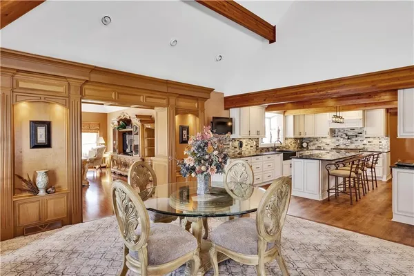 a living room with fireplace furniture and a large window
