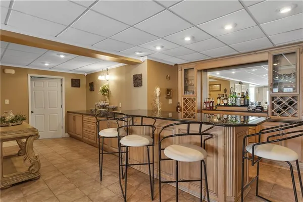 a living room with lots of furniture and a large window