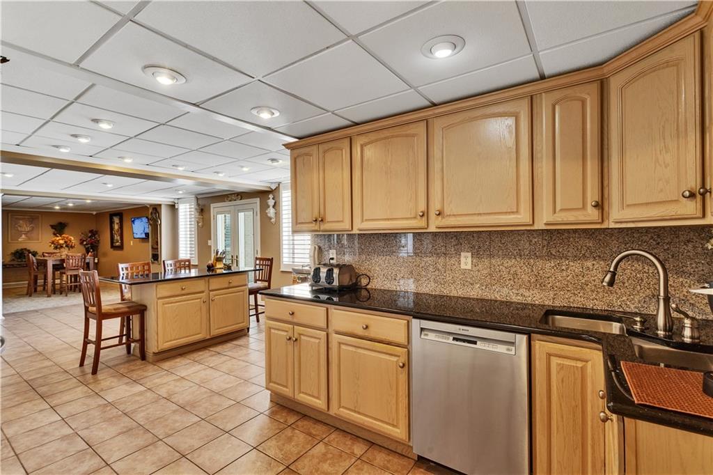 204 South Links Avenue Butler, PA 16001 - Photo 38 of 49 a kitchen with sink a stove and cabinets