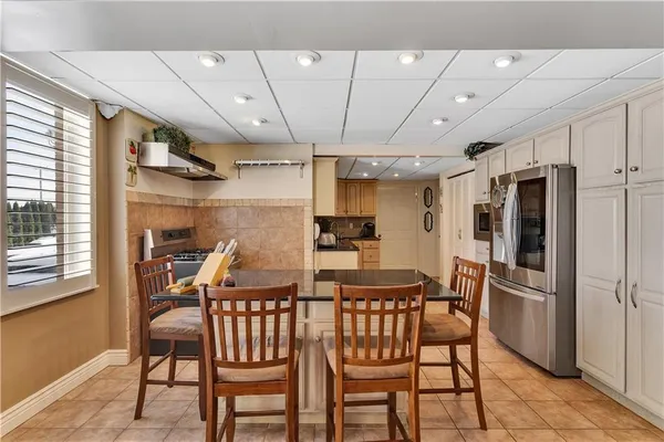 a bathroom with a shower sink and mirror