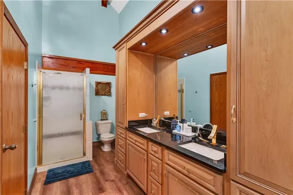 a bathroom with a double vanity sink and a mirror