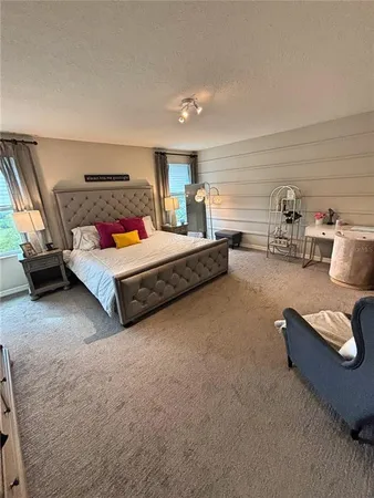 a bedroom with furniture and a couch