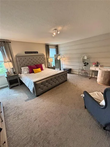 a bedroom with furniture and a couch