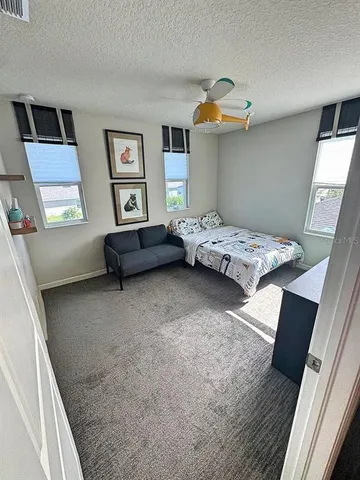 a bedroom with furniture and window