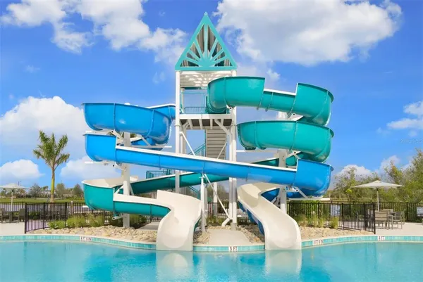 a view of swimming pool with outdoor seating