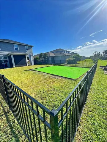 a view of swimming pool with a patio