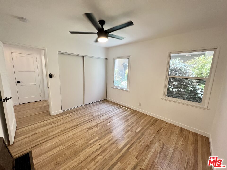 7962 Norton Avenue, Unit 2 West Hollywood, CA 90046 - Photo 11 of 12 wooden floor in an empty room with a window