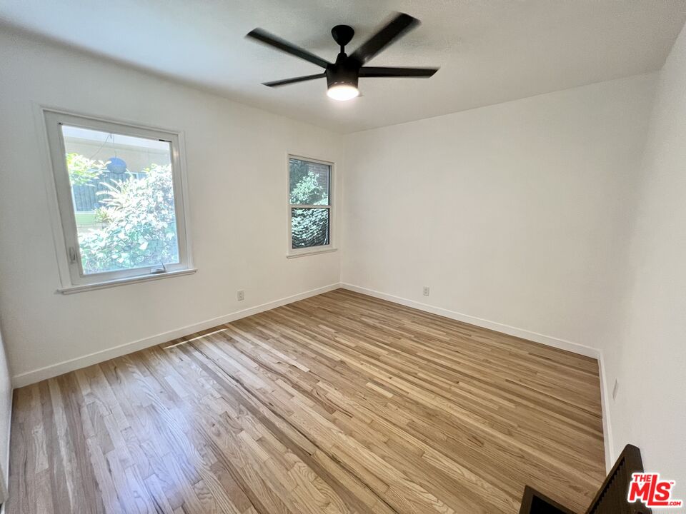 7962 Norton Avenue, Unit 2 West Hollywood, CA 90046 - Photo 12 of 12 a view of empty room with wooden floor and fan