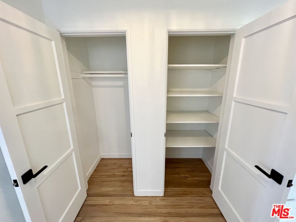 7962 Norton Avenue, Unit 2 West Hollywood, CA 90046 - Photo 8 of 12 a view of walk in closet with wooden floor