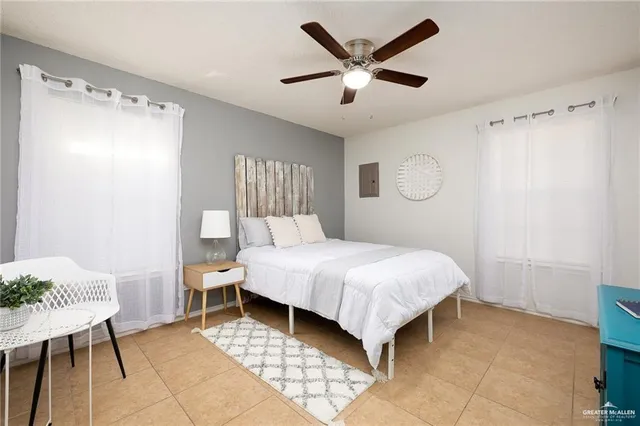 a bedroom with a bed and a table in it