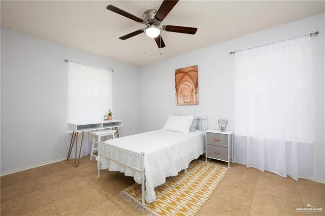 a bedroom with a bed and a table in it