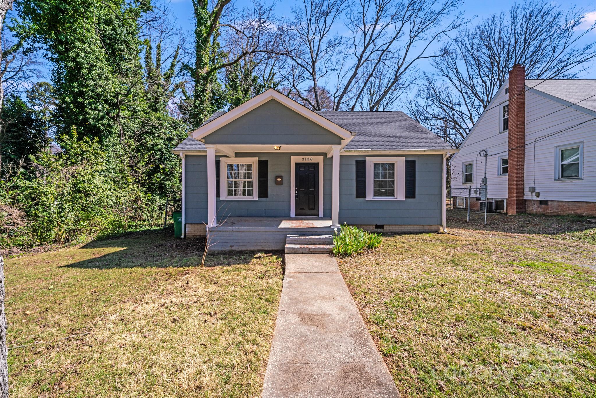 3138 Morson Street Charlotte, NC 28208 - Photo 1 of 21 a front view of a house with a yard