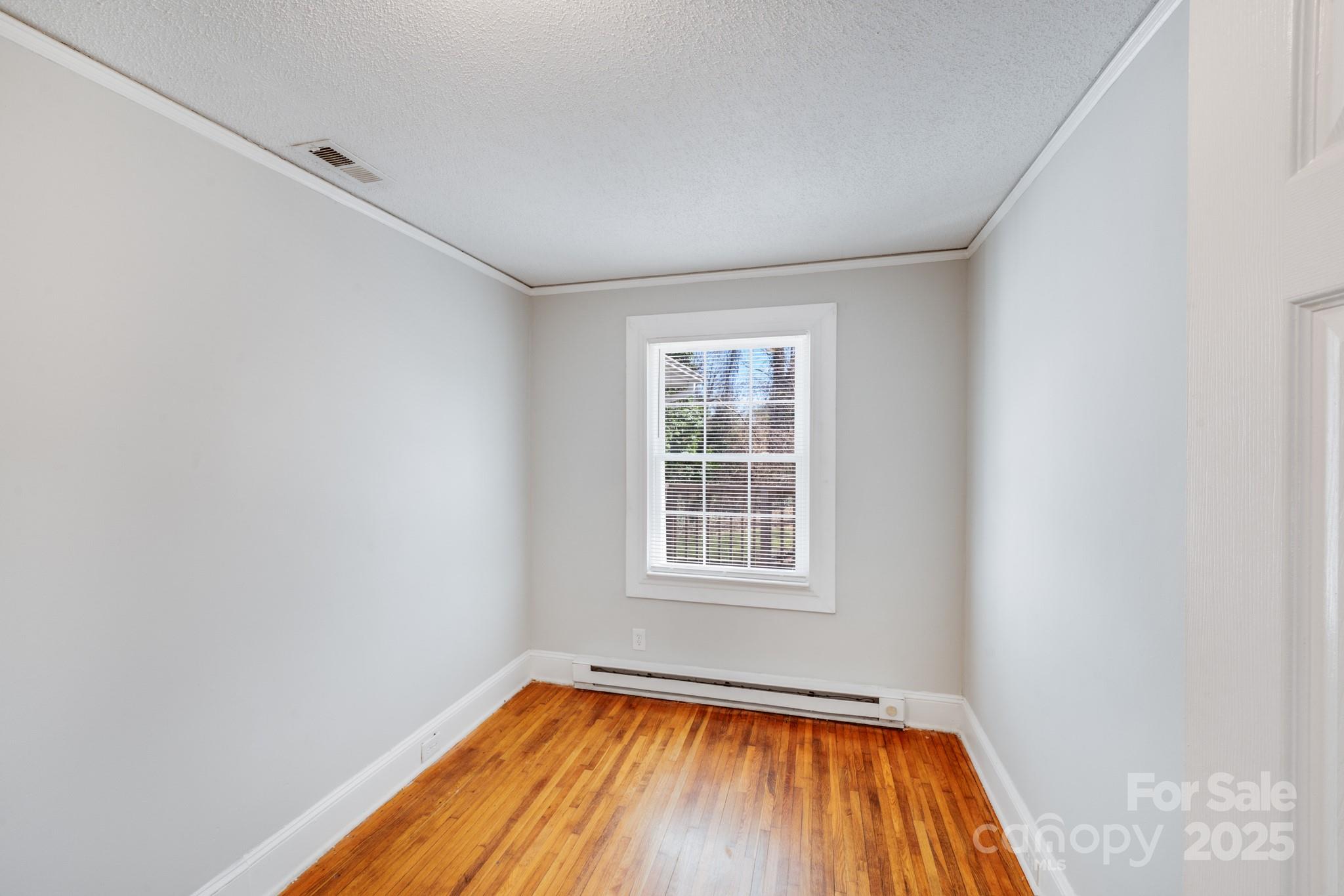 3138 Morson Street Charlotte, NC 28208 - Photo 11 of 21 a view of empty room with window
