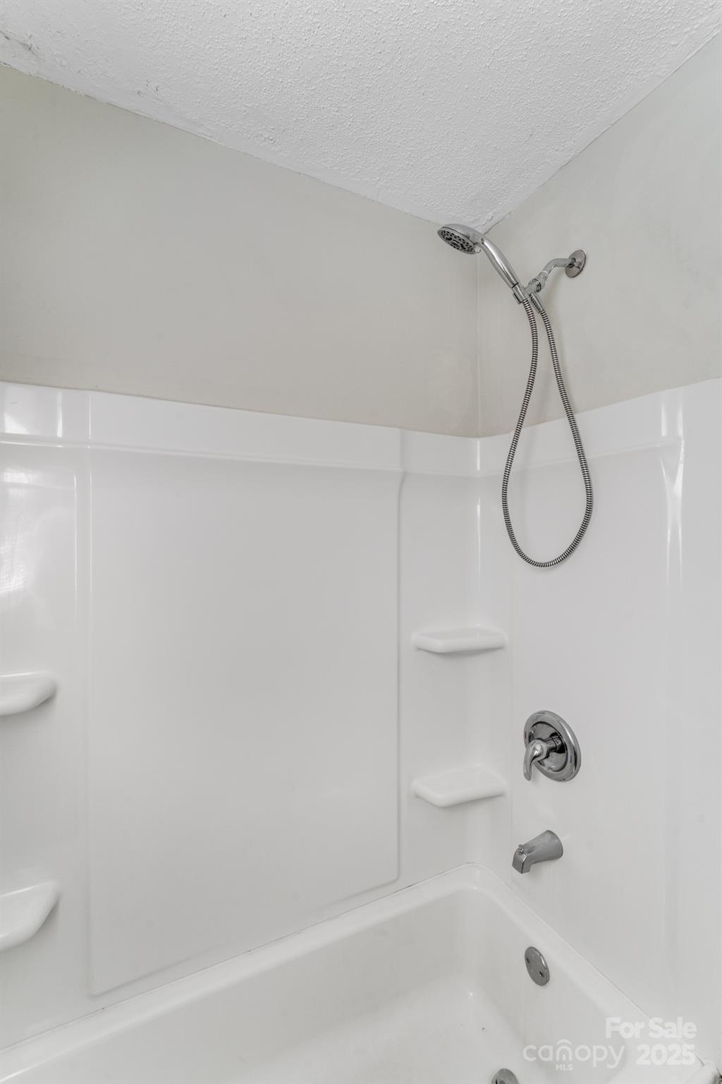 3138 Morson Street Charlotte, NC 28208 - Photo 14 of 21 a bathroom with a bath tub with a shower