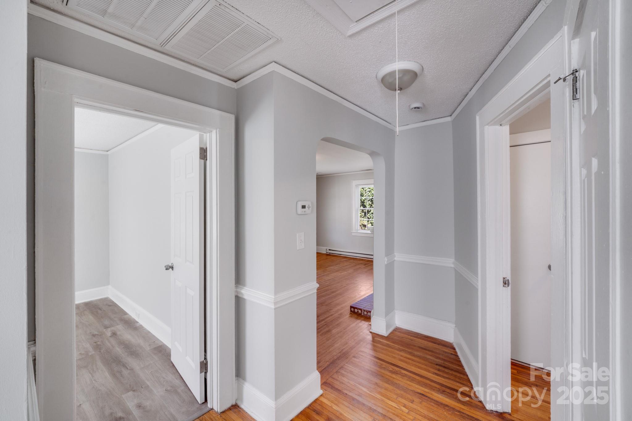 3138 Morson Street Charlotte, NC 28208 - Photo 16 of 21 a view of a room with wooden floor and a bathroom