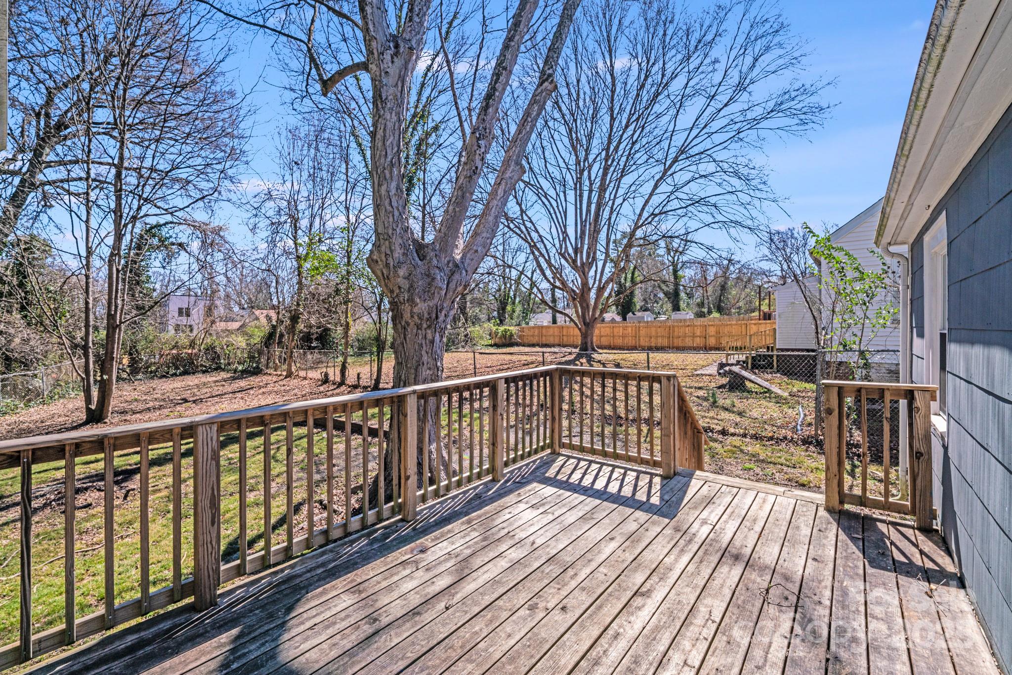 3138 Morson Street Charlotte, NC 28208 - Photo 17 of 21 a view of balcony with wooden floor and fence