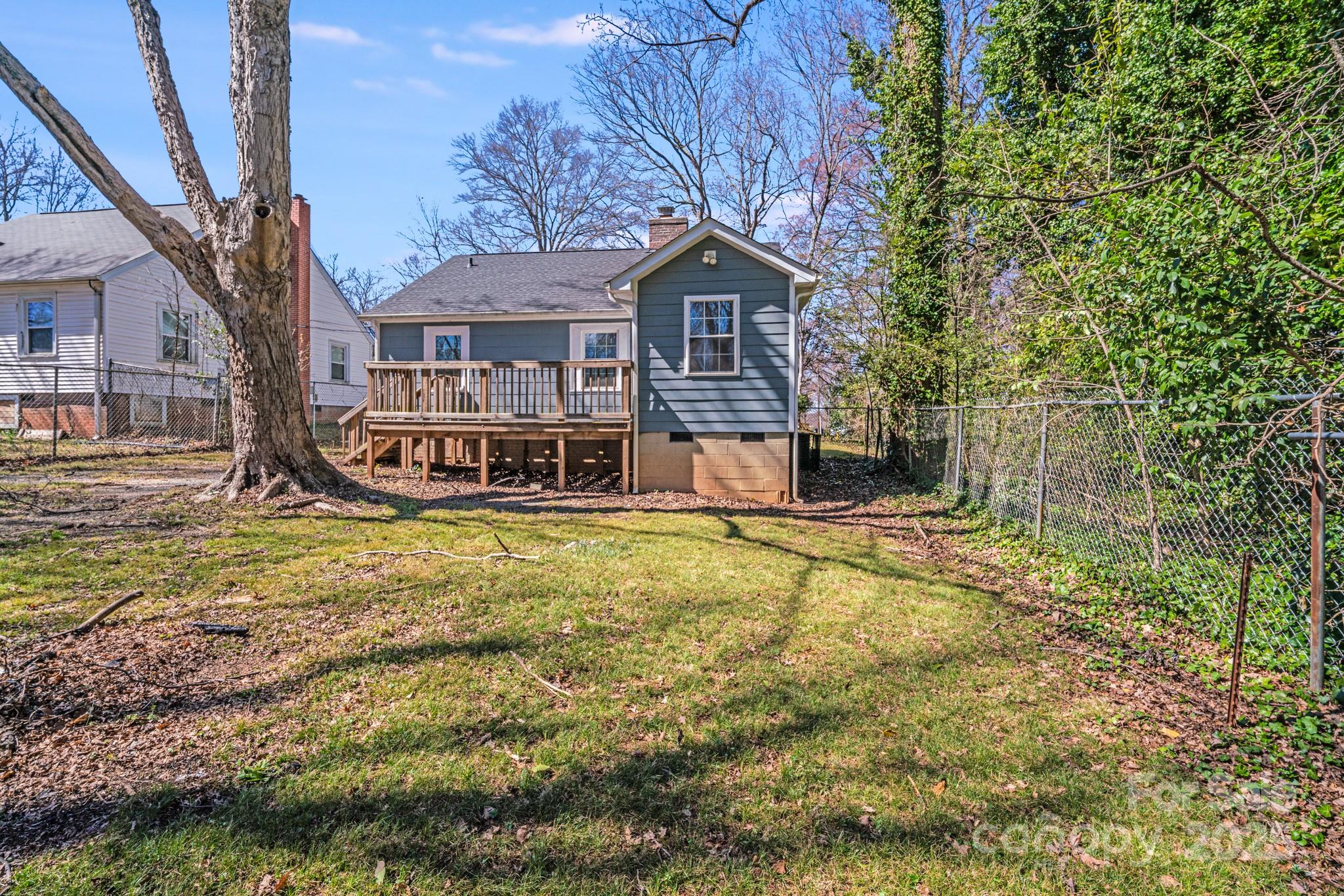 3138 Morson Street Charlotte, NC 28208 - Photo 20 of 21 a front view of a house with a yard and large tree
