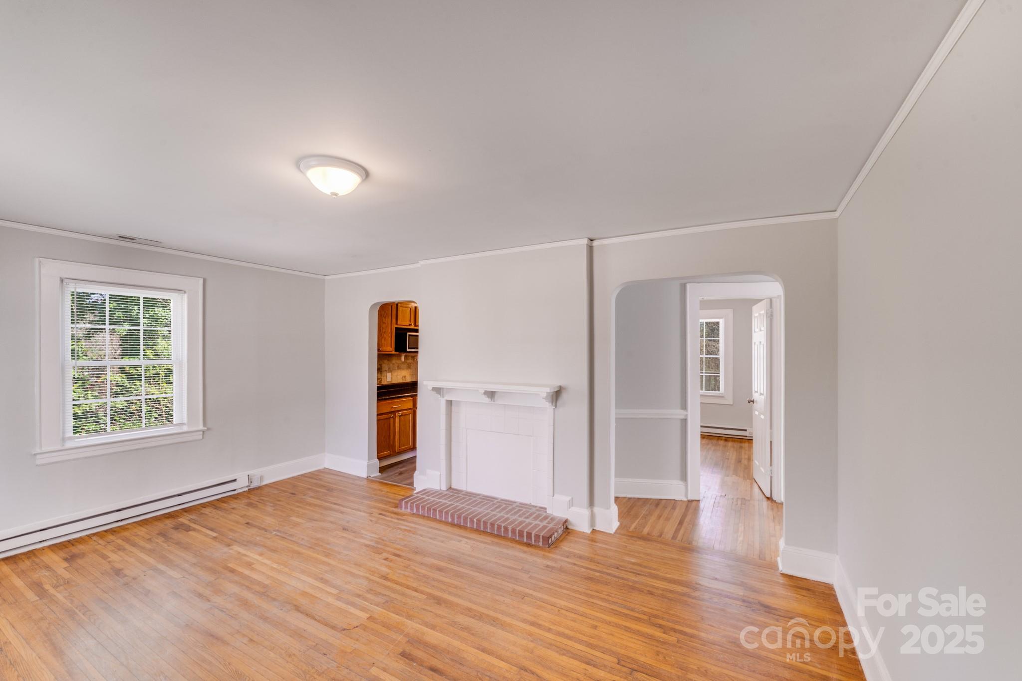 3138 Morson Street Charlotte, NC 28208 - Photo 7 of 21 wooden floor and windows in a room
