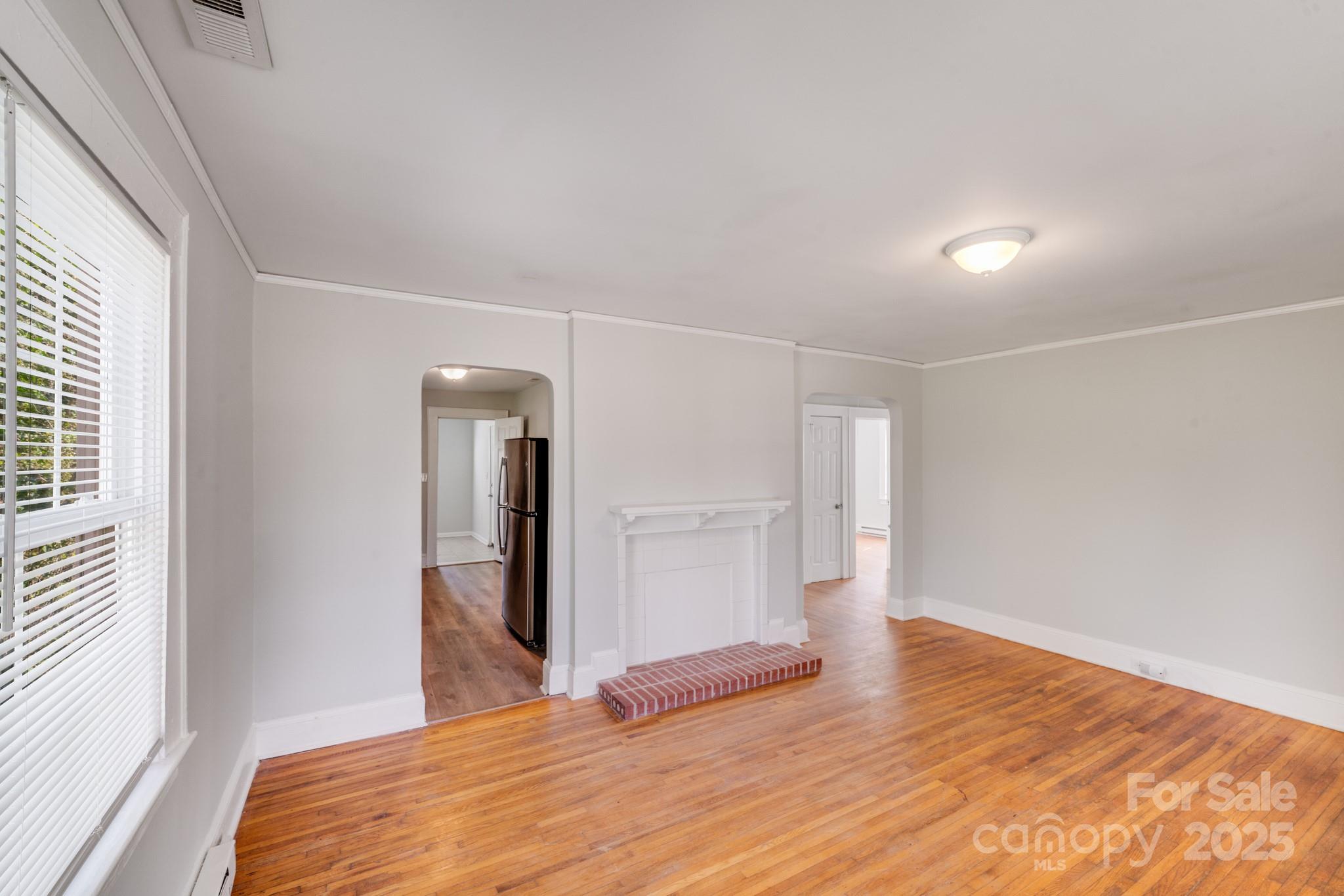 3138 Morson Street Charlotte, NC 28208 - Photo 8 of 21 a bedroom with a bed and a window