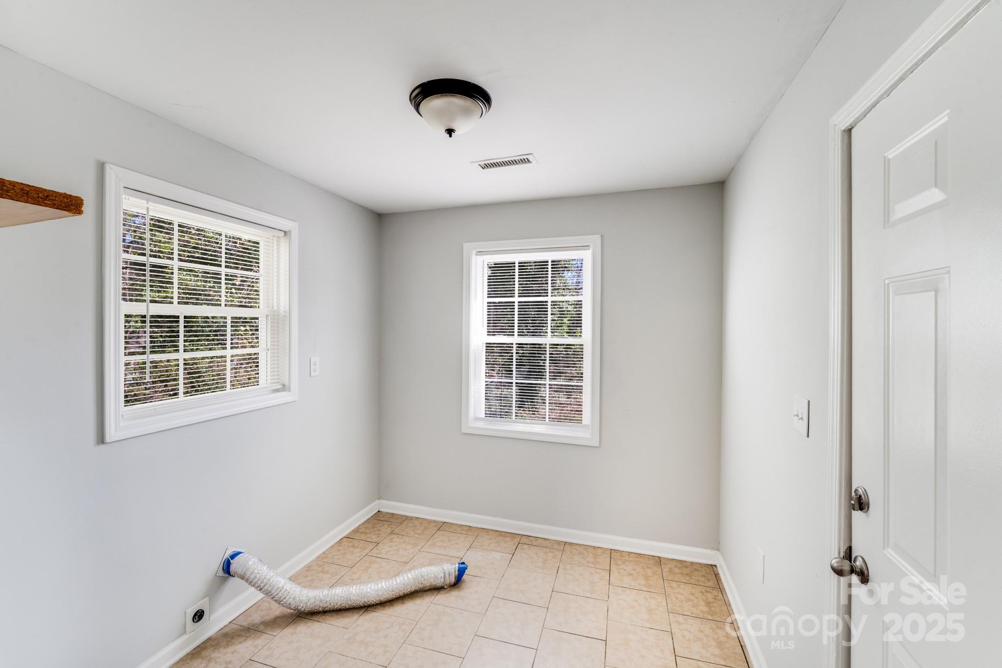 3138 Morson Street Charlotte, NC 28208 - Photo 10 of 21 an empty room with windows
