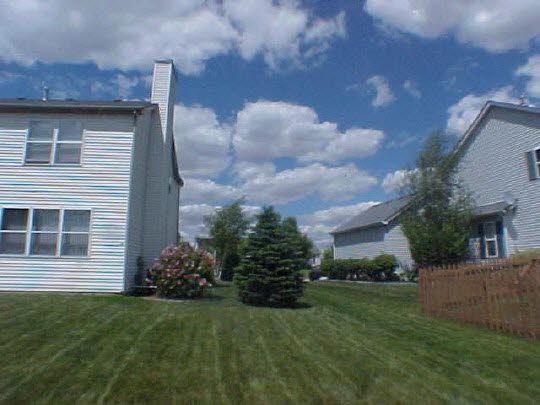 2501 Ridgefield Drive Belvidere, IL 61008 - Photo 2 of 6 a view of a house with a yard