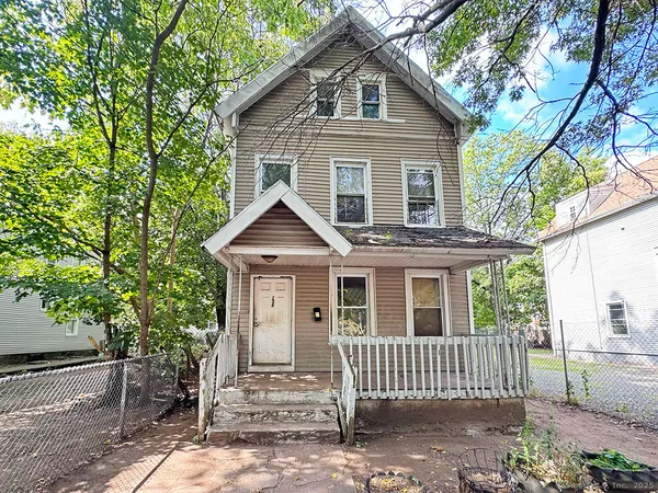 a front view of a house with a porch