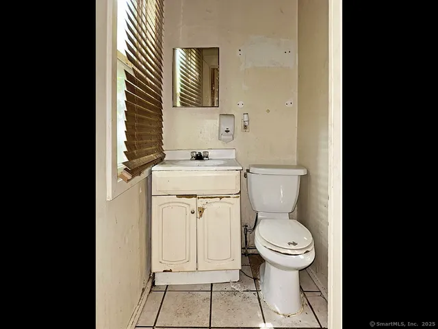 a bathroom with a toilet and a sink