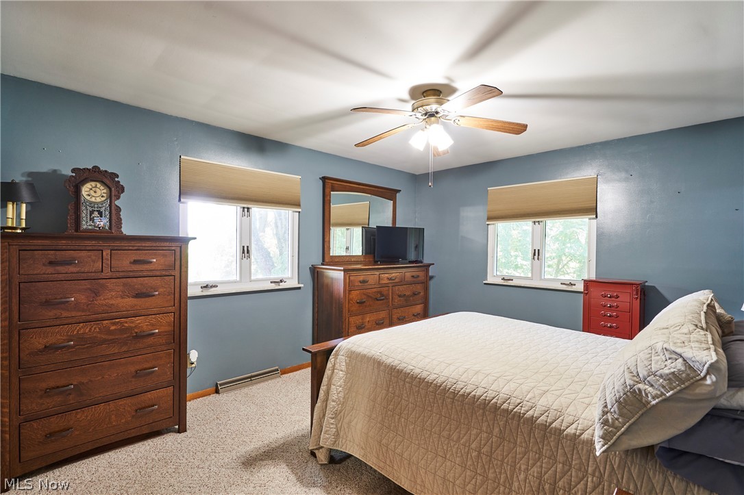 1865 Hartville Road Mogadore, OH 44260 - Photo 9 of 28 primary bedroom with hardwood floors under the carpet