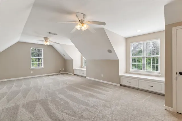 a view of a balcony with wooden floor
