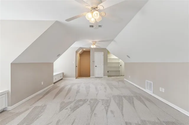 a swimming pool with trees in front of it