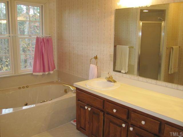 5616 North Hawthorne Way Raleigh, NC 27613 - Photo 8 of 12 Whirlpool tub, separate shower, double sinks, lots of cabinet storage Master Bath/Spa