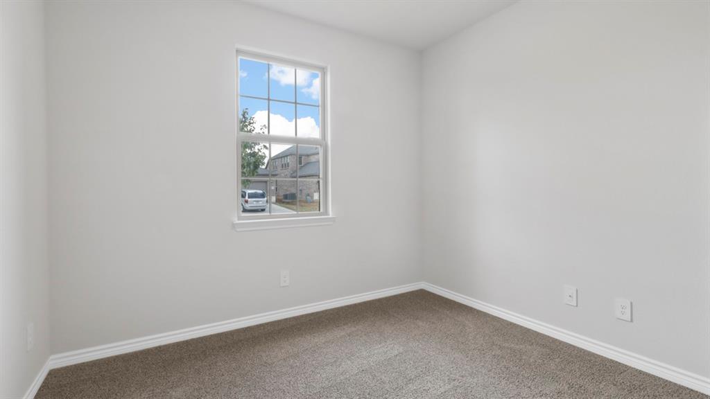 510 Range Road Caddo Mills, TX 75135 - Photo 9 of 25 Carpeted empty room featuring baseboards