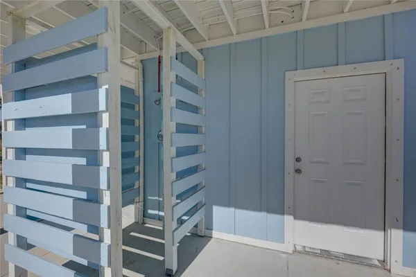 a view of a green field with sky in the background