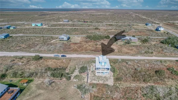 a view of a room with wooden floor and cabinet