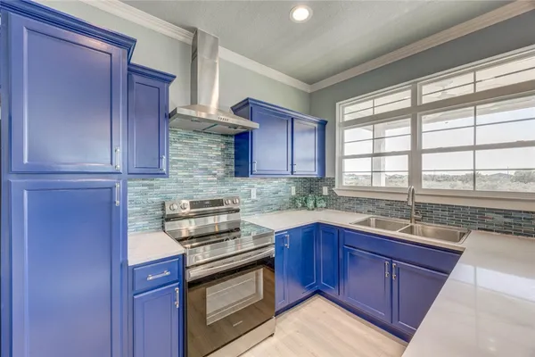 a kitchen with stainless steel appliances granite countertop wooden cabinets sink and window