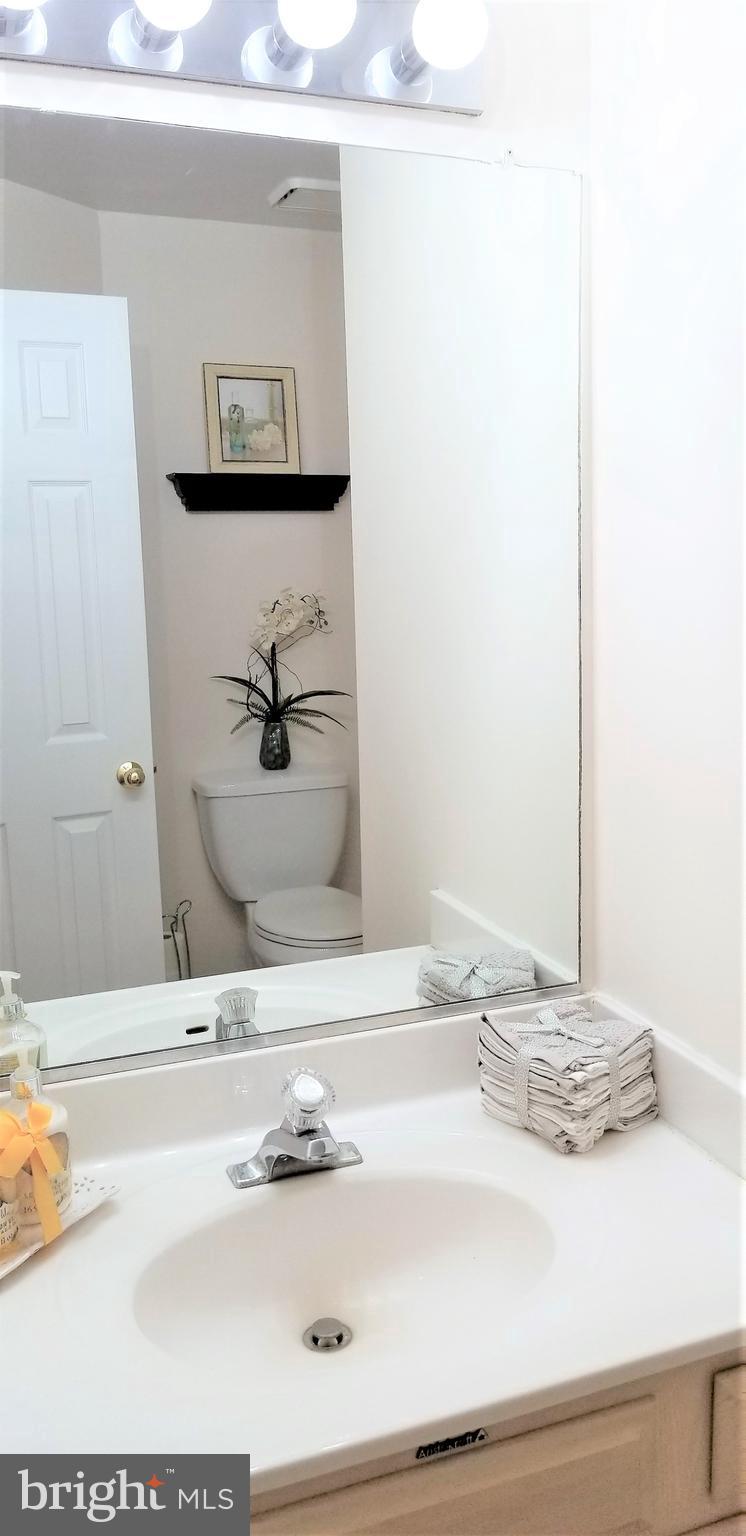 10955 Rocky Mt Way Silver Spring, MD 20902 - Photo 13 of 30 a bathroom with a sink and a mirror