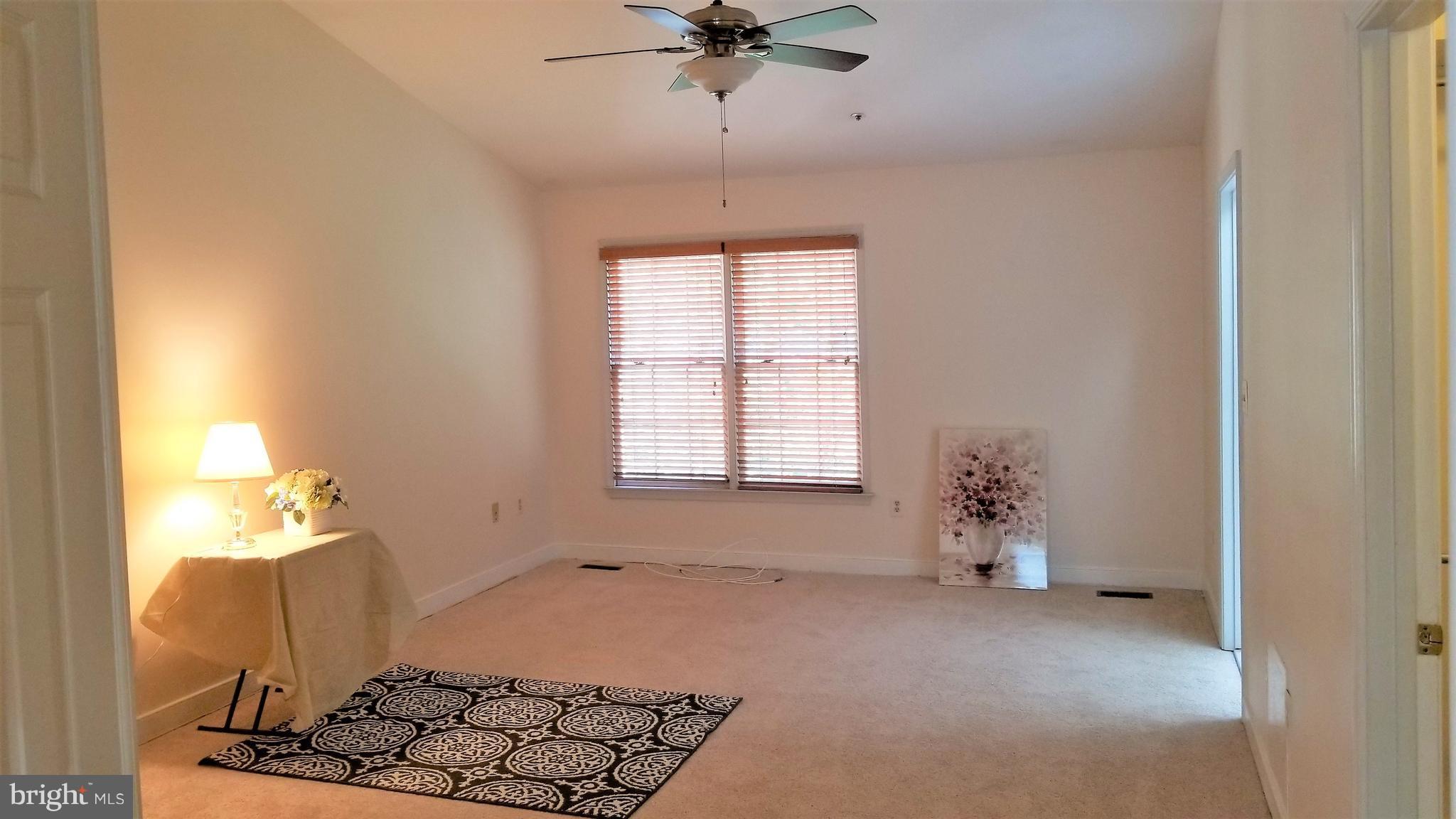 10955 Rocky Mt Way Silver Spring, MD 20902 - Photo 14 of 30 wooden floor in an empty room with a window