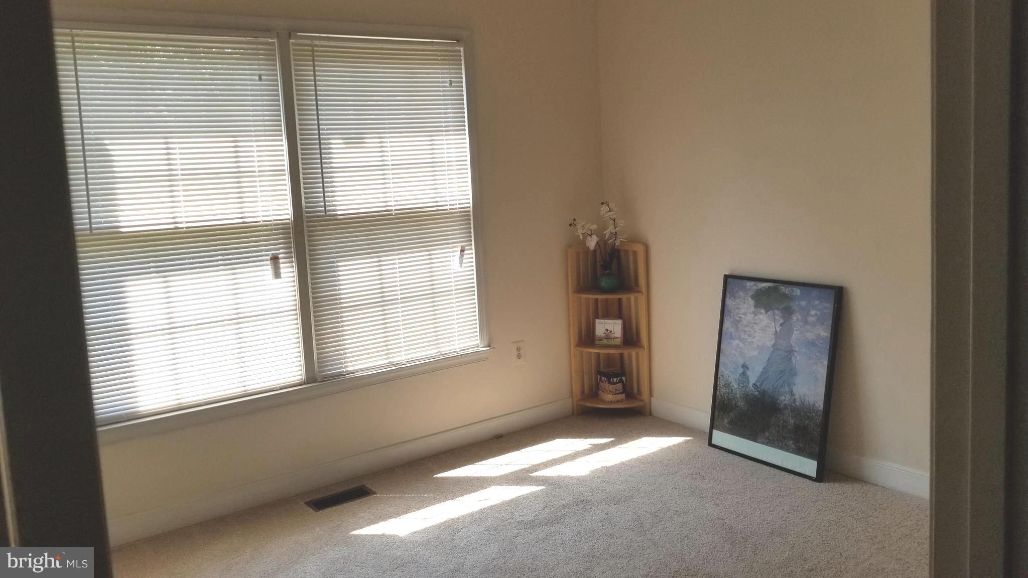 10955 Rocky Mt Way Silver Spring, MD 20902 - Photo 22 of 30 a view of an empty room with a window